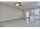 Spacious living room with wood-look flooring and access to the kitchen at 6116 Ripple Way # 47, South Fulton, GA 30349