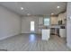 Open layout showing kitchen and living room with white walls and modern flooring at 6116 Ripple Way # 47, South Fulton, GA 30349