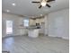 Open floor plan showcasing the kitchen with an island and living room with great natural light at 6116 Ripple Way # 47, South Fulton, GA 30349