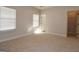 Well-lit bedroom with carpet, closet, and adjacent bathroom access at 329 Rays Ct # 12, Grayson, GA 30017