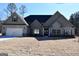 Gray two-story house with a three-car garage and large yard at 329 Rays Ct # 12, Grayson, GA 30017