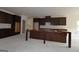 Spacious kitchen featuring dark brown cabinetry and an island at 329 Rays Ct # 12, Grayson, GA 30017
