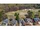 An aerial view of the house from above the golf course, highlighting its picturesque setting at 269 Legends Trce, Mcdonough, GA 30253