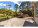 Beautiful backyard with a serene water feature, lush landscaping and a stone patio at 269 Legends Trce, Mcdonough, GA 30253