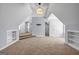 Bonus room featuring neutral carpet, built-in bookshelves, and multiple doors at 269 Legends Trce, Mcdonough, GA 30253