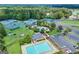 Aerial view of community pools, tennis courts, and surrounding landscaping at 269 Legends Trce, Mcdonough, GA 30253