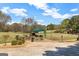 A charming outdoor community space with picnic tables, and lush landscaping on a sunny day, great for Gathering gatherings at 269 Legends Trce, Mcdonough, GA 30253