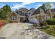 Charming home featuring a well-manicured lawn, beautiful landscaping, and a spacious driveway at 269 Legends Trce, Mcdonough, GA 30253