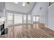 Bright living room with hardwood floors, fireplace, and abundant natural light at 269 Legends Trce, Mcdonough, GA 30253