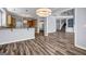 Open-concept living room featuring hardwood floors and staircase leading to the second floor at 269 Legends Trce, Mcdonough, GA 30253