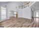 Spacious living room featuring high ceilings, hardwood floors, and a view into the kitchen at 269 Legends Trce, Mcdonough, GA 30253
