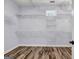 Spacious walk-in closet with shelving and wood-look tile flooring at 269 Legends Trce, Mcdonough, GA 30253