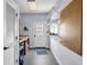 Well-lit workshop area featuring shelving, pegboard, and an exterior door at 269 Legends Trce, Mcdonough, GA 30253