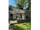 Backyard view of a cozy home featuring a small patio area, perfect for outdoor relaxation at 544 Westmeath Sw Dr, Atlanta, GA 30310