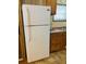 Kitchen with white refrigerator and sink at 215 Highland Dr, Locust Grove, GA 30248
