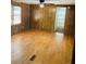 Spacious living room with hardwood floors, natural light, and ceiling fan at 215 Highland Dr, Locust Grove, GA 30248