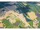 Aerial view of an expansive property featuring multiple ponds and a long driveway at 1875 Highway 142 E, Covington, GA 30014