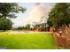 Expansive backyard with a large in-ground pool, a brick patio, and well-maintained lawn at 1875 Highway 142 E, Covington, GA 30014