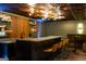 Finished basement bar area with marble countertops and decorative lighting at 1875 Highway 142 E, Covington, GA 30014
