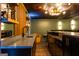 Finished basement bar featuring marble countertops and decorative lighting at 1875 Highway 142 E, Covington, GA 30014