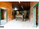 Interior of a barn, filled with wooden walls, and heavy equipment at 1875 Highway 142 E, Covington, GA 30014