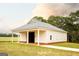 Barn with a white exterior on a green lawn at 1875 Highway 142 E, Covington, GA 30014