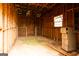 Interior view of an unfinished basement with exposed wooden framework and rustic charm, offering renovation potential at 1875 Highway 142 E, Covington, GA 30014