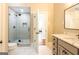 Bathroom featuring a glass shower with black trim, undermount sink and view into the living room at 1875 Highway 142 E, Covington, GA 30014