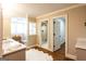 Bright bathroom featuring a vanity, glass-enclosed shower, wood floors, and a stylish white rug at 1875 Highway 142 E, Covington, GA 30014