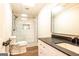 Modern bathroom with glass-enclosed shower, white marble tile, vanity, and toilet at 1875 Highway 142 E, Covington, GA 30014