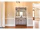 Charming bathroom with a view, featuring a marble countertop, shaker cabinets, and black hardware at 1875 Highway 142 E, Covington, GA 30014