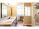 Well-lit bathroom featuring white marble countertops, modern fixtures, and a frameless glass shower at 1875 Highway 142 E, Covington, GA 30014