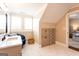 Bright bathroom featuring marble floors, a vanity with sink, and custom cabinet storage at 1875 Highway 142 E, Covington, GA 30014