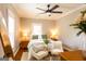 Relaxing bedroom showcases natural light, comfortable seating, and a ceiling fan at 1875 Highway 142 E, Covington, GA 30014