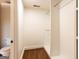 Walk-in closet featuring custom shelving and hardwood floors at 1875 Highway 142 E, Covington, GA 30014