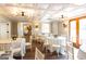 Elegant dining room featuring tables with white linens and modern lighting fixtures at 1875 Highway 142 E, Covington, GA 30014