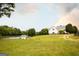 Beautifully landscaped property with a charming home, picturesque pond, and black fencing, offering serene country living at 1875 Highway 142 E, Covington, GA 30014