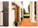 Charming home exterior showcasing the beautiful double door entrance, stylish lighting, and brick pavers at 1875 Highway 142 E, Covington, GA 30014