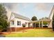 An attractive two-story home with brick accents, a covered porch, and a beautifully landscaped yard at 1875 Highway 142 E, Covington, GA 30014