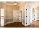 Hallway showcases arched doorways, contrasting door hardware, and hardwood flooring at 1875 Highway 142 E, Covington, GA 30014