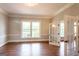 Living room with hardwood floors and large windows offering lots of natural light at 1875 Highway 142 E, Covington, GA 30014