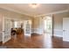 Elegant living room with hardwood floors and an open concept layout leading to the outside and other rooms at 1875 Highway 142 E, Covington, GA 30014