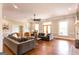Bright living room with hardwood floors, neutral paint, and ample seating perfect for entertaining guests at 1875 Highway 142 E, Covington, GA 30014