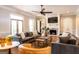 Inviting living room with hardwood floors, coffered ceiling, fireplace, and french doors to the outside at 1875 Highway 142 E, Covington, GA 30014