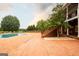 Large backyard featuring a rectangular pool, brick pavers, and mature trees at 1875 Highway 142 E, Covington, GA 30014