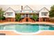 Backyard pool with brick patio and exterior view of the home with a porch at 1875 Highway 142 E, Covington, GA 30014
