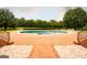 Beautiful backyard with a pool and a view of the property's lake at 1875 Highway 142 E, Covington, GA 30014
