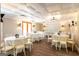 Bright reception room with round tables, white linens, and modern light fixtures at 1875 Highway 142 E, Covington, GA 30014