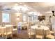 Spacious reception room with round tables, white tablecloths, and decorative centerpieces at 1875 Highway 142 E, Covington, GA 30014