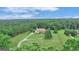 Aerial view of a house on a large lot with trees at 282 Quarters Rd, Fayetteville, GA 30215